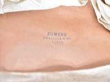 a close up of a purse with a label on it