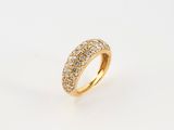a yellow gold ring with white diamonds on a white background