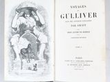 an open book with a picture of a man and a woman sitting on a chair