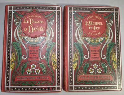 two red books sitting on top of a table next to each other