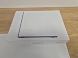 an apple macbook air box sitting on top of a wooden table