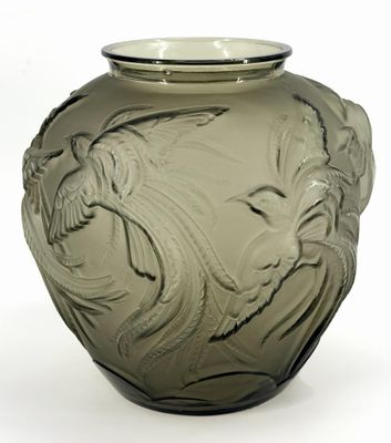 a glass vase with a design on it on a white background