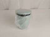 a plastic container with a lid on a white surface