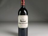 a bottle of wine that is sitting on a table