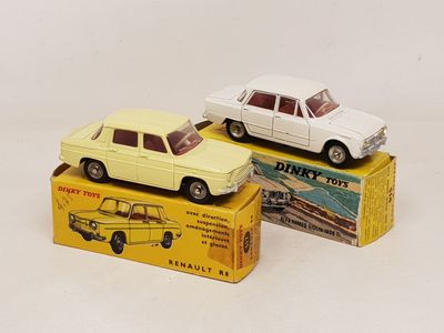 two toy cars that are sitting on top of a box