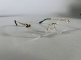 glasses on a table with a white background and a black and gold frame