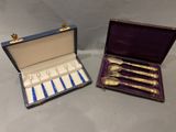 two silverware items in a purple case on a gray surface
