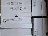 several boxes of electronic devices are stacked on top of each other