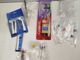 several toothbrushes, toothpaste, toothpaste, toothpaste, toothpaste, toothpaste, toothpaste, toothpaste