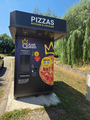 un distributeur automatique sur lequel est représentée une pizza