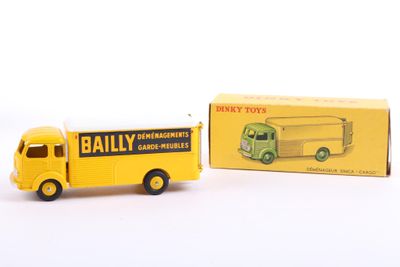 yellow and green toy truck with box on a white surface