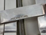 a close up of a knife and fork on a table