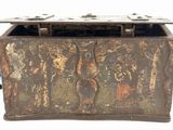 an old metal box with rusted paint on it