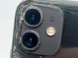 a close up view of a broken iphone with a broken camera lens