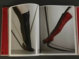 a book with a picture of a woman in high heels