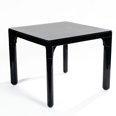 a black table with a black top on a white background