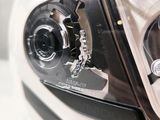 a close up of a motorcycle ' s headlight on display