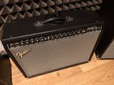 two amps sitting next to each other on a wooden floor