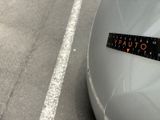 a sticker on the hood of a car that says outuaia