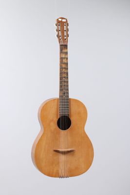 an image of a guitar hanging on a wall