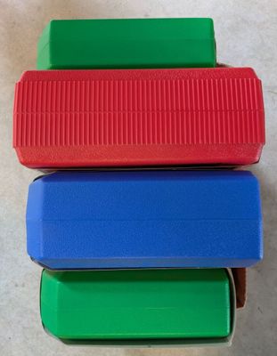 several different colored plastic containers stacked on top of each other