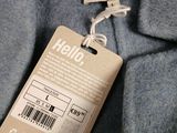 an image of a label on a jacket that is attached to a hanger