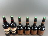 a group of bottles of wine sitting on top of a table