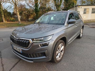 the new skoda is parked in a parking lot in front of a house