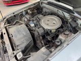 a small engine in the hood of a car