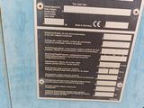 a sign on the side of a blue machine