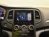 the dashboard of a car with a gps device in the center