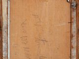 an old picture of a piece of wood with writing on it