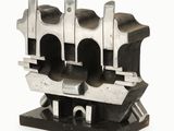 an image of a metal engine block on a white background