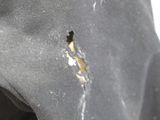 a close up of a person ' s shoe with a hole in it
