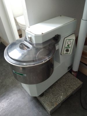 a mixer that is sitting on a counter in a room