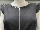 a mannequin wearing a dress with a zipper on it