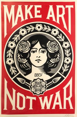 a red and black poster with a woman ' s face in the center