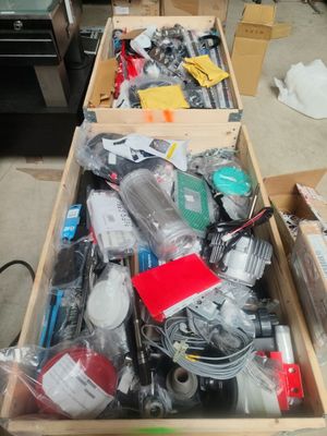 two boxes of assorted items sitting on the floor