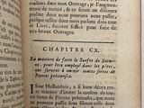 an open book with a black and white image of a man ' s face