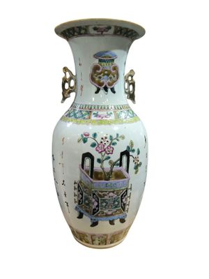 a vase with a picture of a man and a woman on it