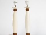 pair of white and brown table lamps with wooden bases