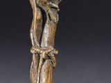 pair of bronze figurines of a bird on a tree branch