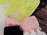 a lot of clothes that are sitting on a table