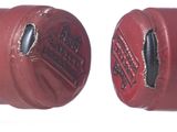 two red cans with black and white designs on them