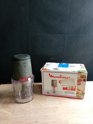 a small blender sitting on a table next to a box of food