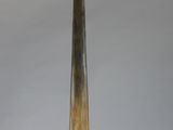 a large horn shaped object on a stand on a white surface