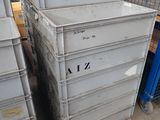 a lot of crates that are stacked up in a warehouse