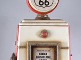 an old fashioned gas pump with a route 66 sign on top