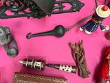 a pink table topped with a bunch of different items
