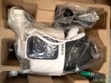 a cell phone in a box wrapped in plastic